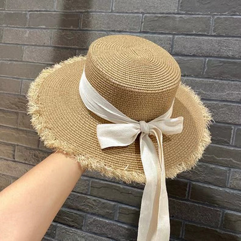 Stylish Straw Hat with Black Ribbon Bow
