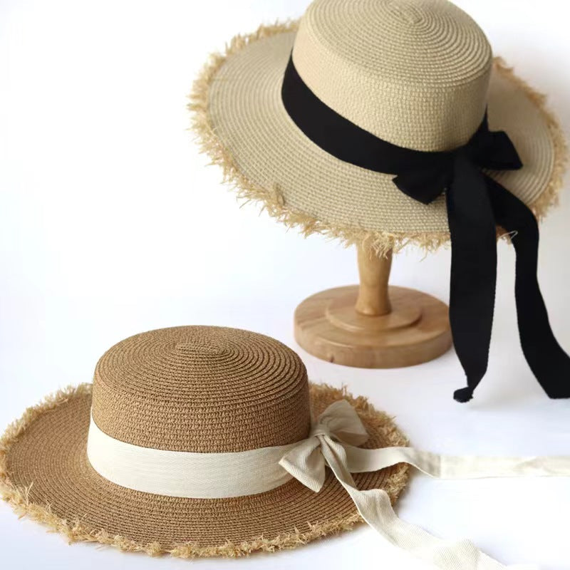 Stylish Straw Hat with Black Ribbon Bow