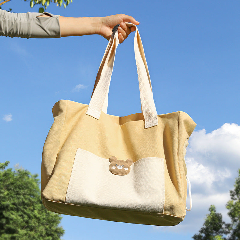 All - Season Pet Travel Essential: The Whimsical Bao Gong - inspired Canvas Pet Carrier with Breathable Design