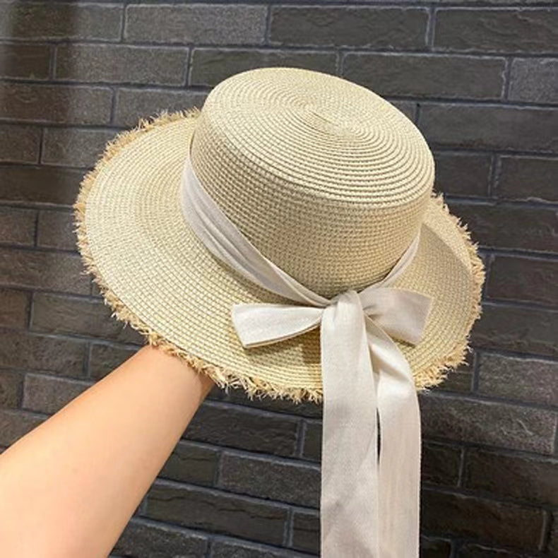 Stylish Straw Hat with Black Ribbon Bow