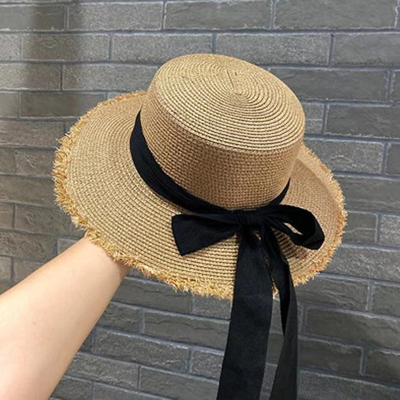 Stylish Straw Hat with Black Ribbon Bow