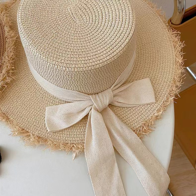 Stylish Straw Hat with Black Ribbon Bow