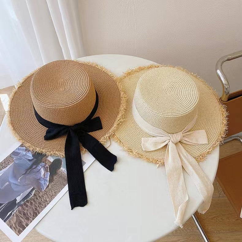 Stylish Straw Hat with Black Ribbon Bow
